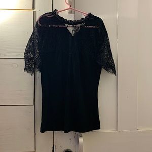 Black t-shirt with lace front and sleeves.